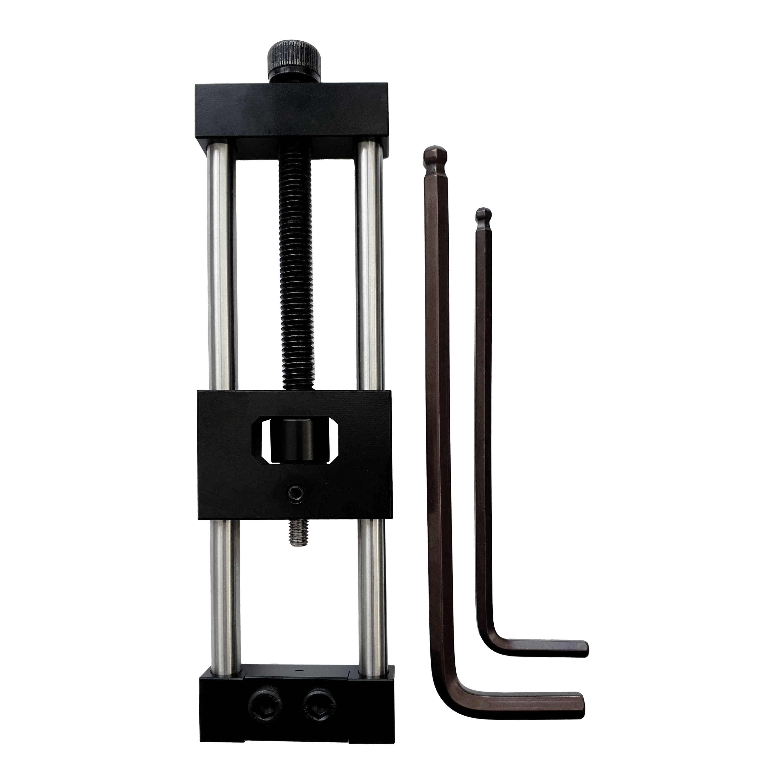 McDart Repointer Pro Das Bild zeigt das Produkt "McDart Repointer Pro" und zwei Inbusschlüssel. Das Gerät ist ein Werkzeug zum Wechseln oder Ausrichten von Dartspitzen.