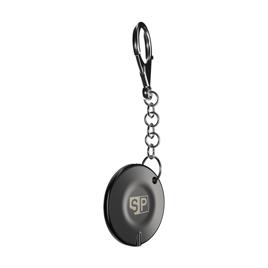 340007_Target_Swiss_Point_Key_Premium_2 Das Bild zeigt den "Target Swiss Point Key Premium", einen runden Schlüsselanhänger mit Kette und Karabinerhaken. Auf der Vorderseite ist ein "SP"-Logo sichtbar.