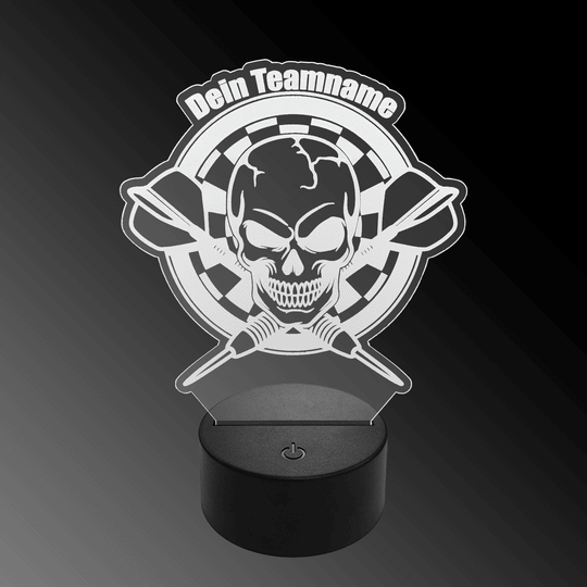 Das Bild zeigt eine LED-Lampe mit einem Plexiglas-Aufsatz in Form eines Totenkopfs vor einer Dartscheibe mit zwei gekreuzten Dartpfeilen. Oben steht der Schriftzug "Dein Teamname".