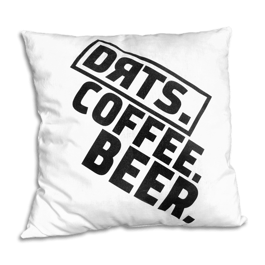 DRTS_K2_DRTS_Kissen_Weiss_1 Das Bild zeigt ein weißes Kissen mit schwarzem Aufdruck. Auf dem Kissen steht: "DRTS. COFFEE. BEER."